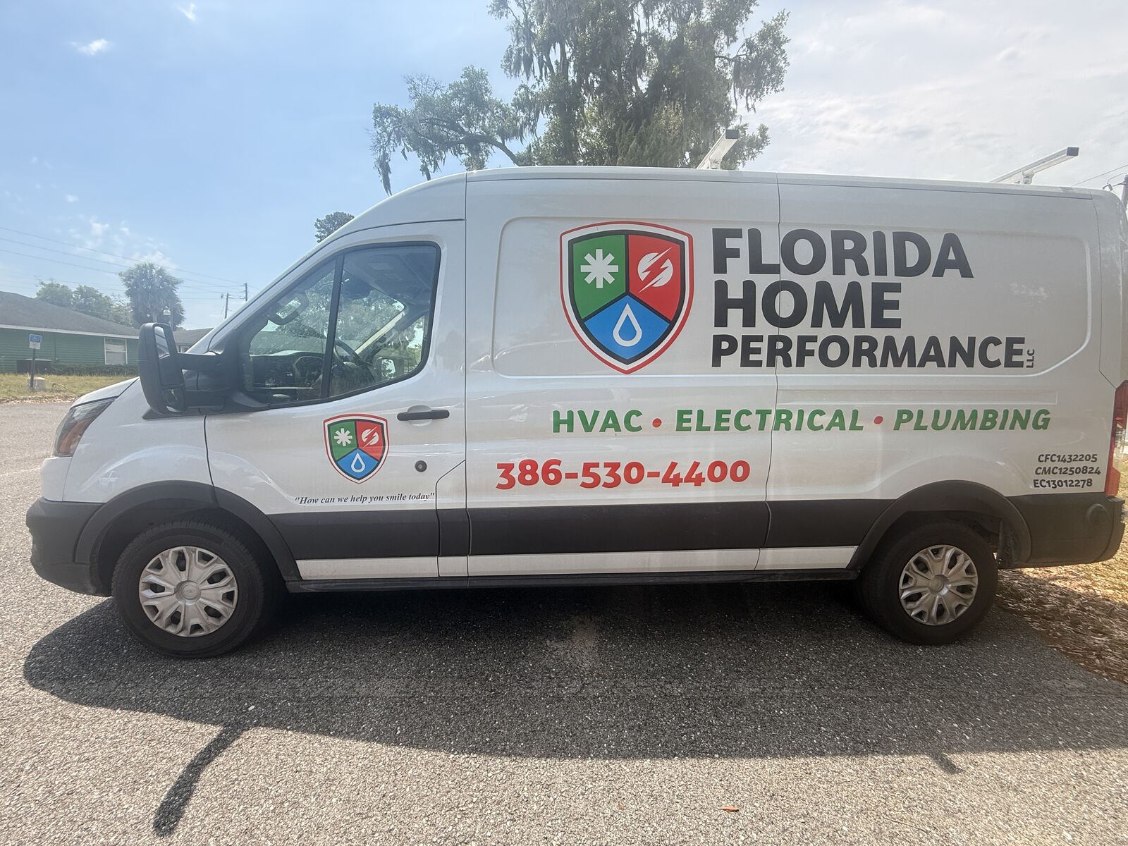 Florida Home Performance branded service van - side view showing HVAC, Electrical, Plumbing services
